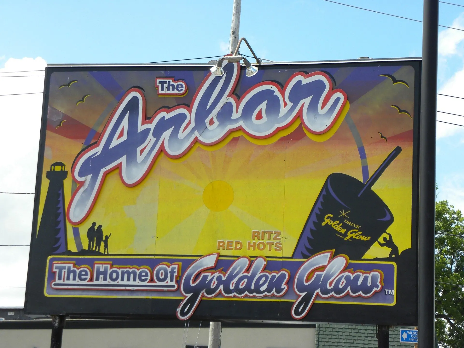 The Arbor's sign on Main Street in Port Dover, advertising Golden Glow and Ritz Red Hots, July 2009.