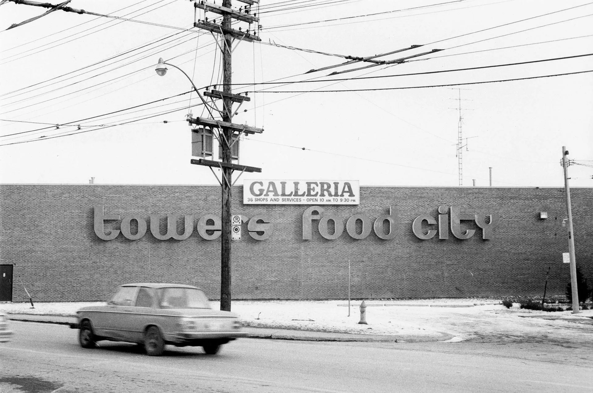 Signs for Towers and Food City at the Galleria shopping centre on Dupont Street, Toronto, 1980.